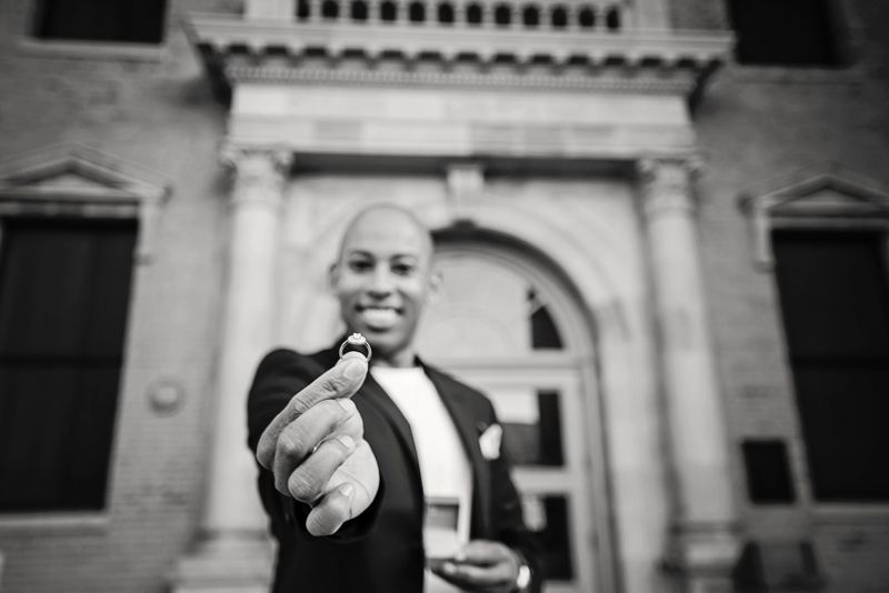 Black and white portrait of Lemar in front of a building